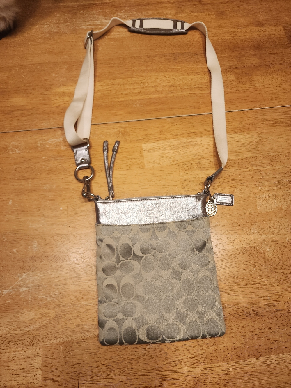 Coach Signature Swingpack Crossbody Bag featuring the brand’s classic "C